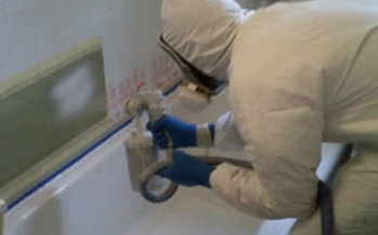 bath refinishing technician spraying